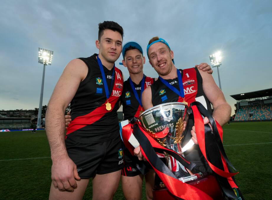 Living the dream: Arion Richter-Salter with five-time premiership stars Jack Avent and Brad Cox-Goodyer. Picture: Phillip Biggs