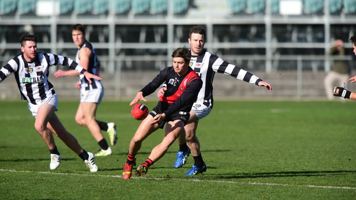 Get him in: Jay Lockhart outrunning his Glenorchy opponent in his Bombers days. Lockhart makes his AFL debut against Geelong on Saturday. Picture: Paul Scambler