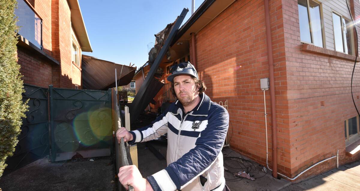 TARGETED: Mark Williams stands in front of his parents' wind-damaged home at Kings Meadows on Wednesday, after looters raided the property. Picture: Paul Scambler.