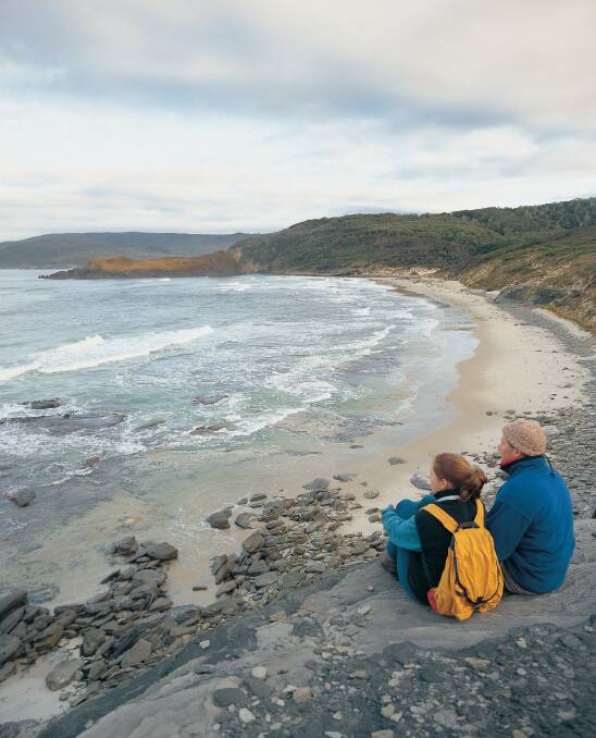 Discover South Cape Bay Beach: For our go-to guide on camping around Cockle Creek, see page 12. Picture: Tourism Tasmania and Geoffrey Lea