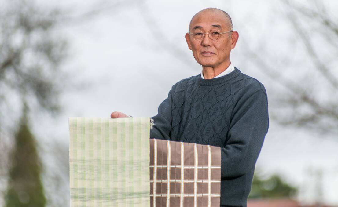 TEXTILE TRAINING: Master weaver Koichi Tanji from Japan with two samples of obi, a sash for traditional Japanese dress and part of kimono outfits. Mr Tanji visited Launceston for a two-day workshop. Picture: Phillip Biggs