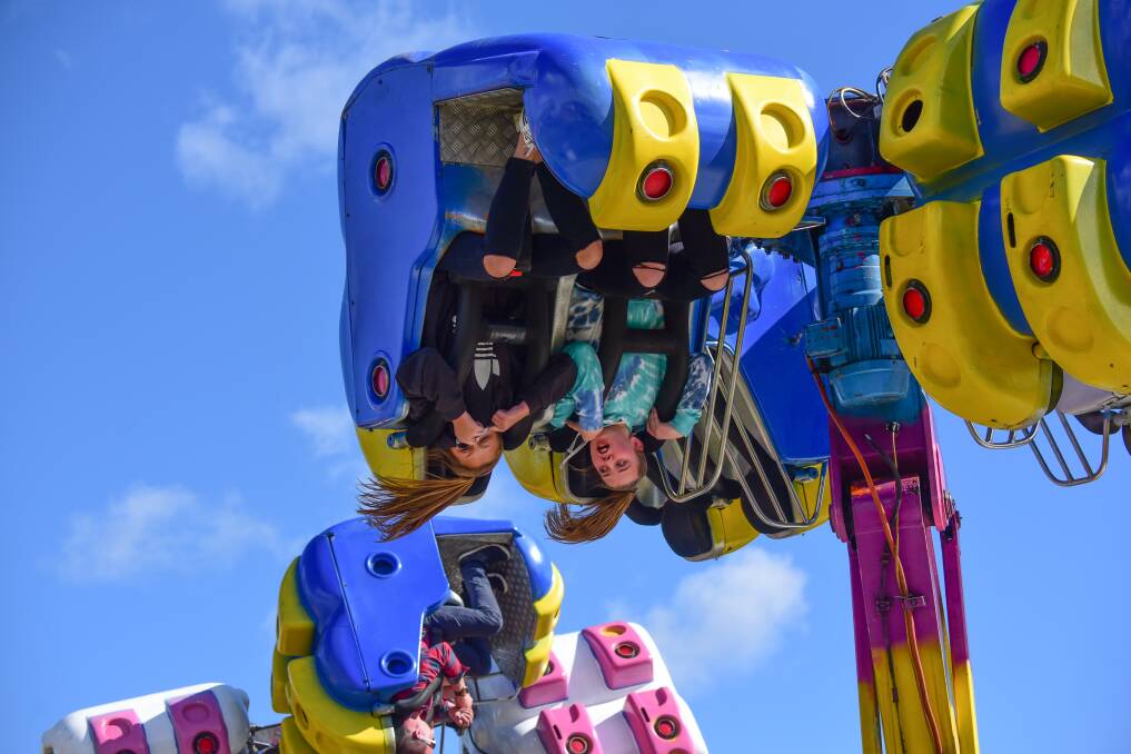 WILD RIDE: Maddy Brazendale, 12, and Bella Delaney, 12, of Launceston enjoy the rides in sideshow alley at this year's Royal Launceston Show. 2017 marked the 144th Launceston Show. Picture: Paul Scambler 