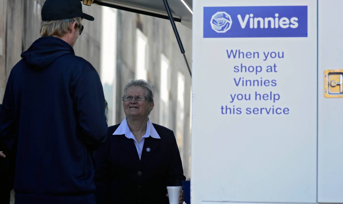 FACILITATING OUTREACH: St Vincent de Paul Society state president Toni Muir with "B". at the Vinnies Van, an after-hours mobile service providing food, information and support to those in need.