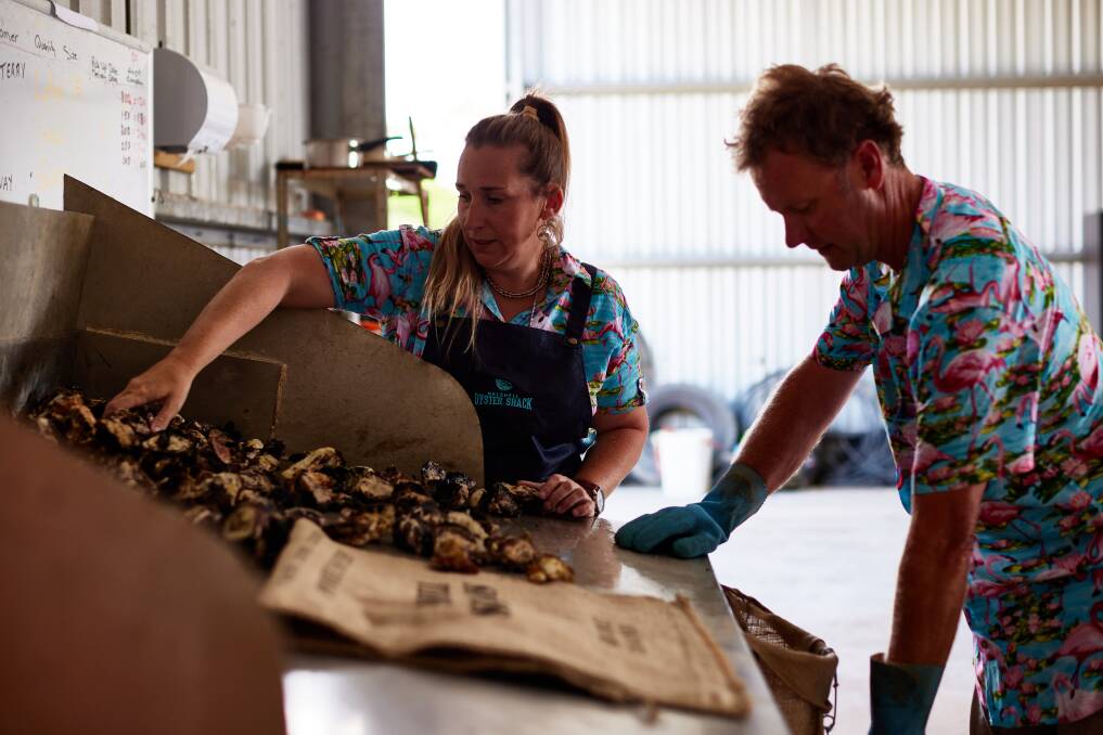 SHINING SUCCESS: Ian and Cassie Melrose, Melshell Sea Farms, preparing an order in their processing and shucking room at Dolphin Sands on the East Coast of Tasmania. Photos: Sam Shelley