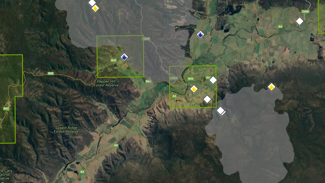 There are two large fires (in grey) burning on either side of Fingal (green box, centre). Picture: Tasmania Fire Service 