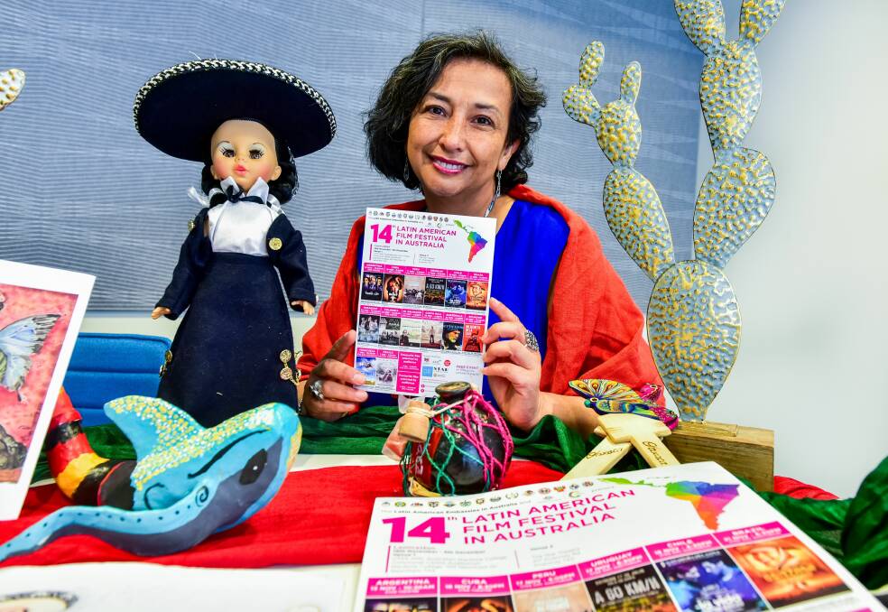 MUY BIEN: Maria Elena Chagoya, volunteer co-ordinator of the Latin American Film Festival, with items from her native Mexican culture. Picture: Neil Richardson 