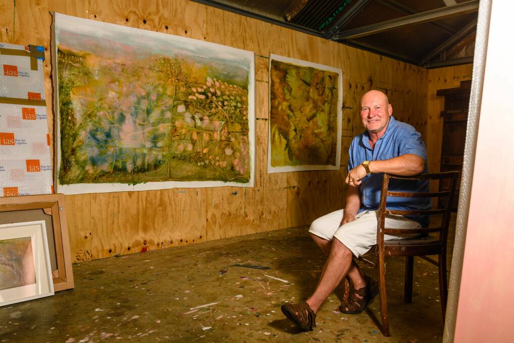 HARD AT WORK: Richard Dunlop is his studio at the converted 19th-century grain silage he calls home. Picture: Scott Gelston. 