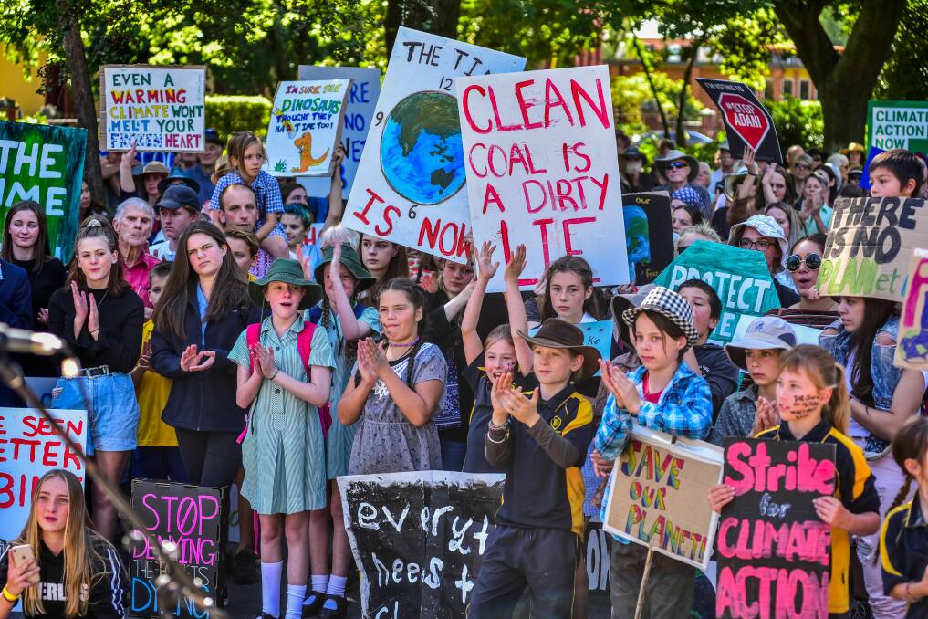 ABOVE AND LEFT: Young people at the March 8 School Strike for Climate in Launceston. Pictures: Neil Richardson 