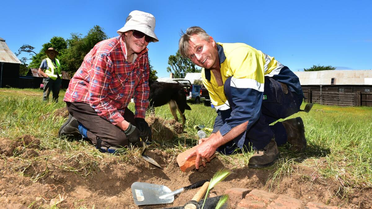 HISTORY UNEARTHED: Peta Newman and Darren Watton examining convict-made bricks uncovered at Brickendon Estate. Picture: Neil Richardson 