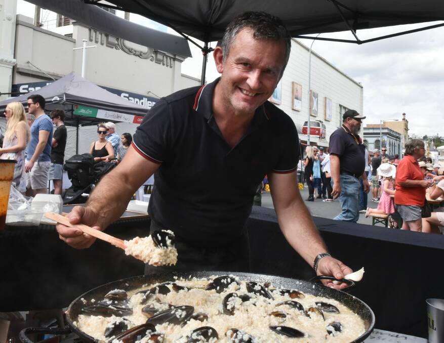 DELICIOUS: Damon Wecker preparing a mussel and prawn risotto at Little Italy 2017. Picture: Neil Richardson 