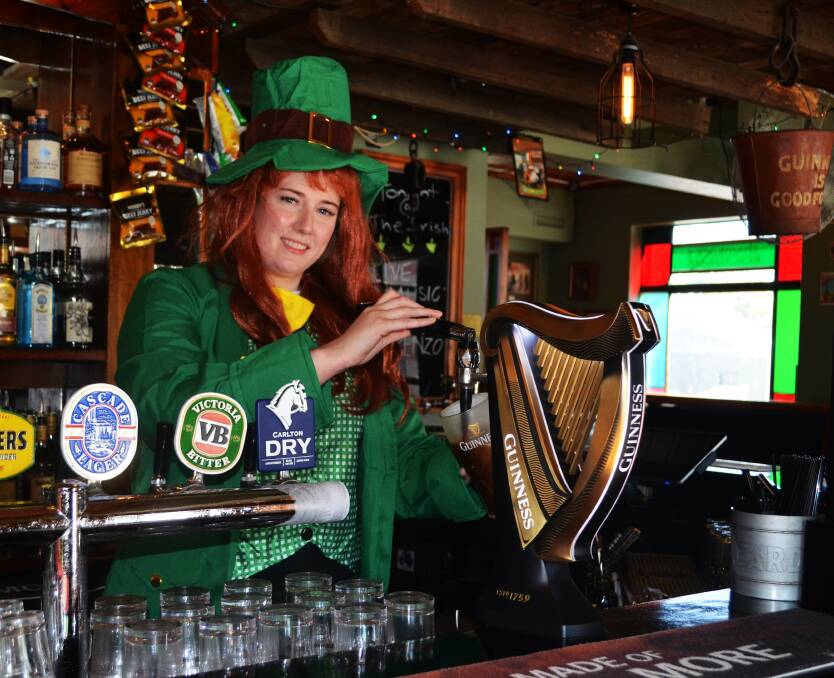 LUCKY: Bartender Bridget Beach preparing for St Patrick's Day. Picture: Frances Vinall 