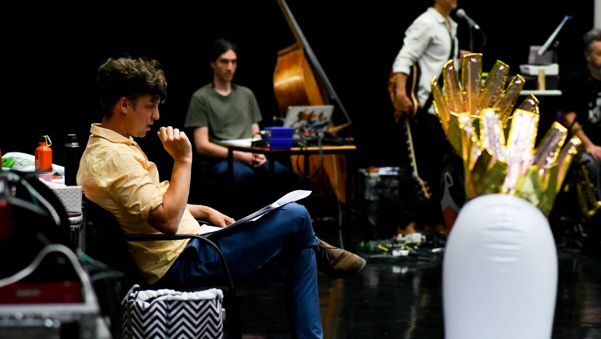 Director Sam Routledge takes notes at a King Ubu rehearsal. 