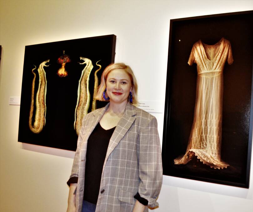 GOTHIC: QVMAG curator of visual art and design Ashleigh Whatling with two works in the exhibition. Picture: Frances Vinall 