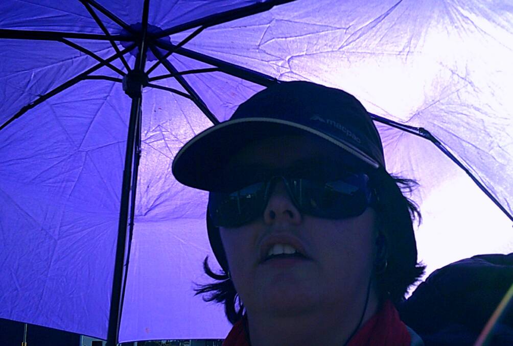 LEFT: Eliana on her walk, with her protective umbrella. Picture: Eliana Robinson 