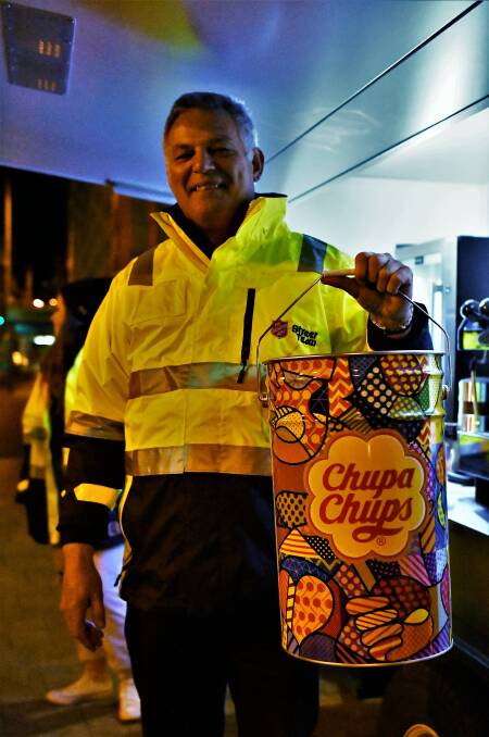 Warren Reeve with the tin of Chupa Chups, which the Street Team buy in lots of 1000. 