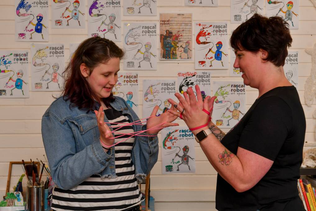 Sara Ferrington with daughter Ginger Crowe, 13, work on arty homeschooling ideas to send to parents. 