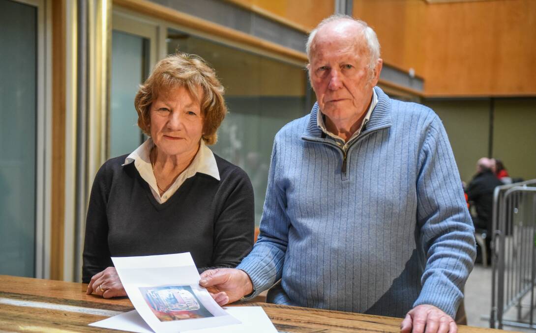 DEVOTED: Jenny and George Chandler with an image of a Ben Miller painting that will be auctioned for the church. Picture: Paul Scambler