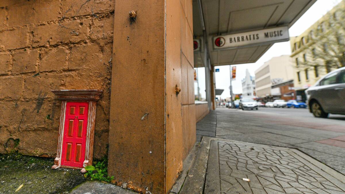 MINIATURE: One of many tiny doors hidden around Launceston, in places high and low. Picture: Scott Gelston 