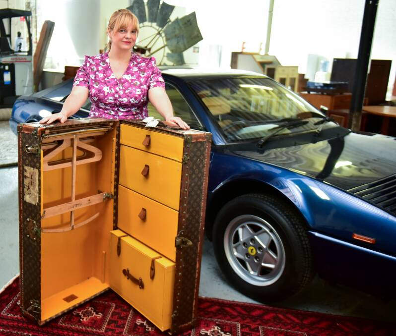 ANY TAKERS: Tullochs Auctions director Jessie Reid with the 1925 Louis Vuitton case and Ferrari the auctionhouse is selling. Picture: Neil Richardson 