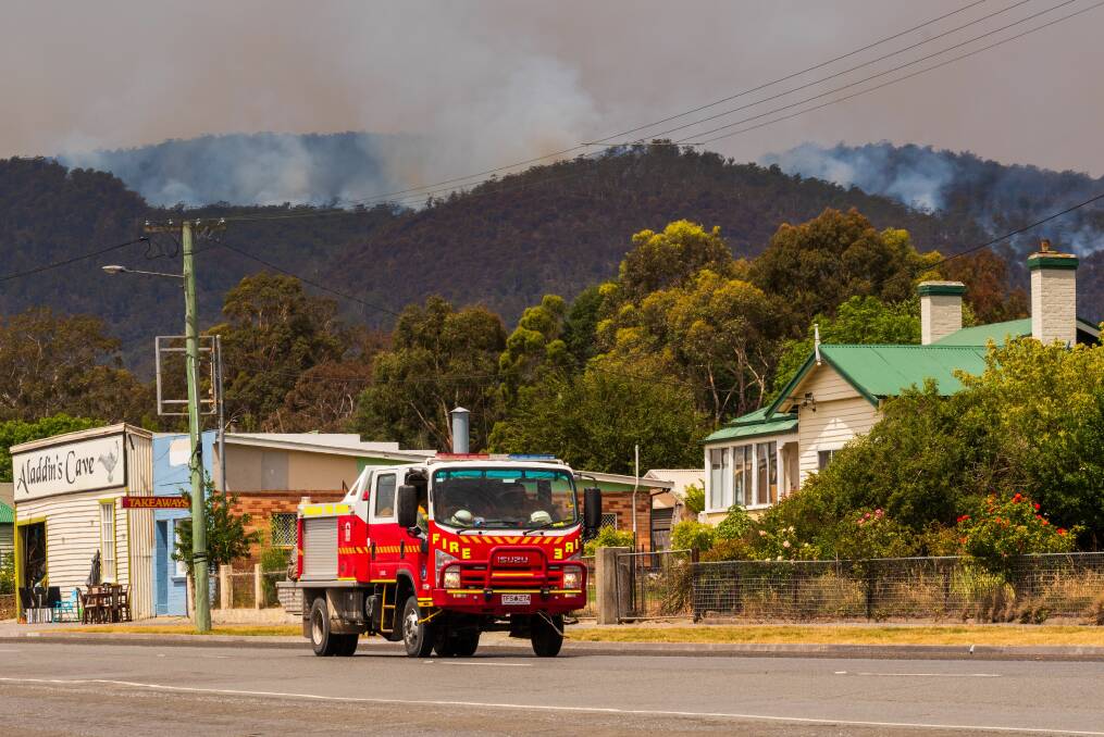 A firetruck moves through the town of Fingal on Sunday. Picture: Phillip Biggs 