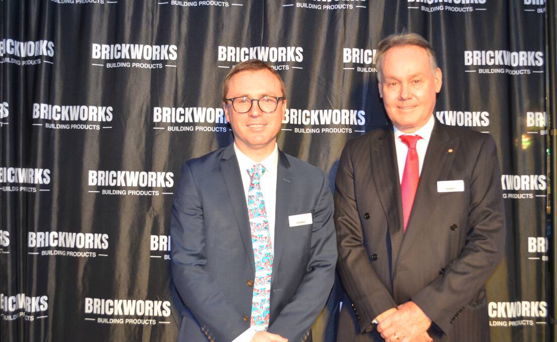 POP THE CHAMPAGNE: Brickworks Limited group general manager Mark Ellenor and managing director Lindsay Partridge AM at the opening of the Launceston Brickworks Design Centre. Picture: Frances Vinall