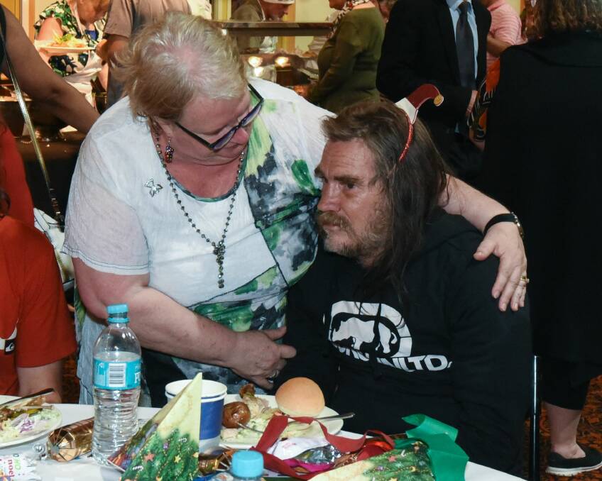 CARING: Michelle Ryan with Daniel at the Launceston Community Christmas. Picture: Neil Richardson 
