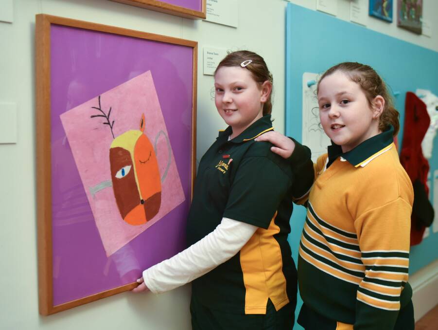 BUDDING ARTIST: Brianna Towns, 11, with her artwork Deer Cosie, and sister Jasmine Towns. Picture: Neil Richardson 