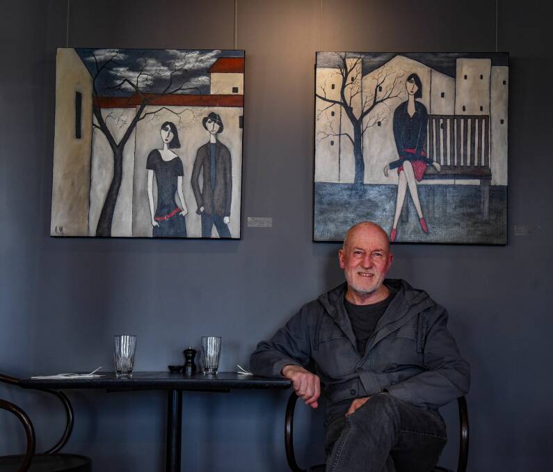 STARK LINES: Tony Martin with two of his paintings exhibited at Stillwater. Picture: Paul Scambler 