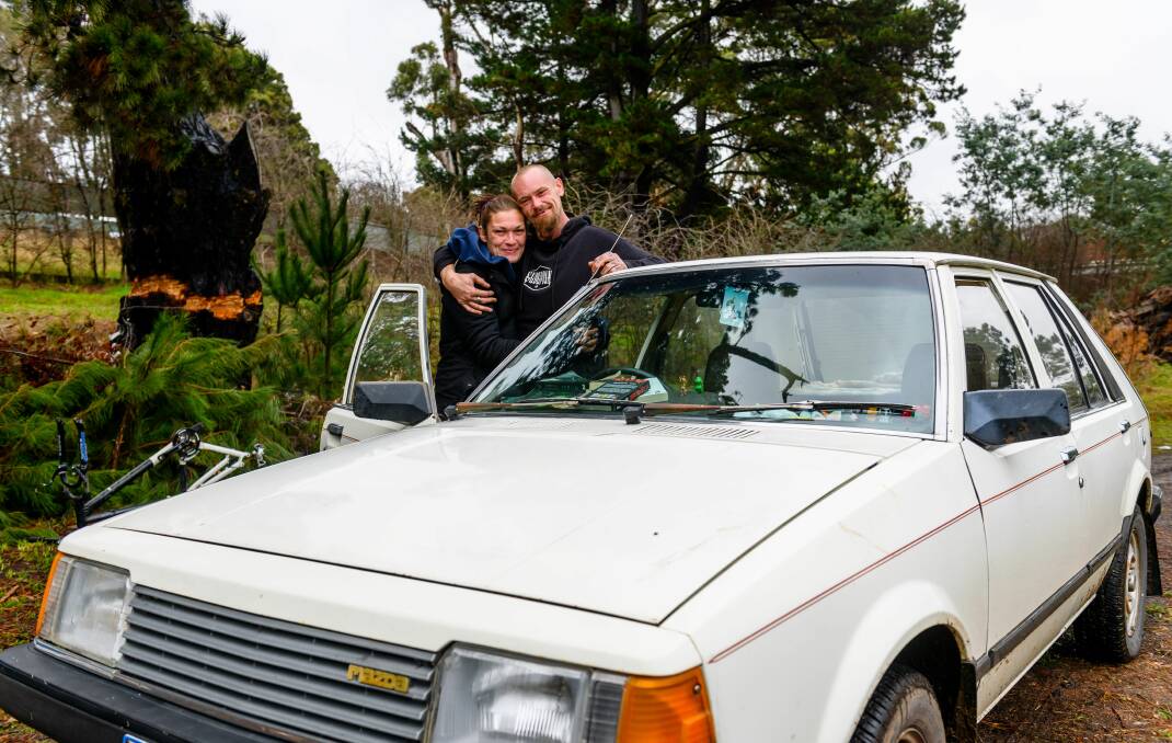 GRATEFUL: Leah and Budgie Williams with their second-hand car donated to the family by a stranger. Picture: Scott Gelston 