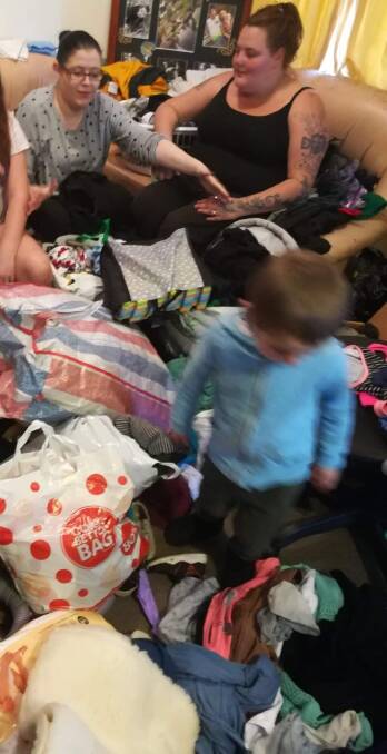DONATIONS: Taylor Burnie (right) accepts donations after her house was destroyed by fire. Picture: Supplied