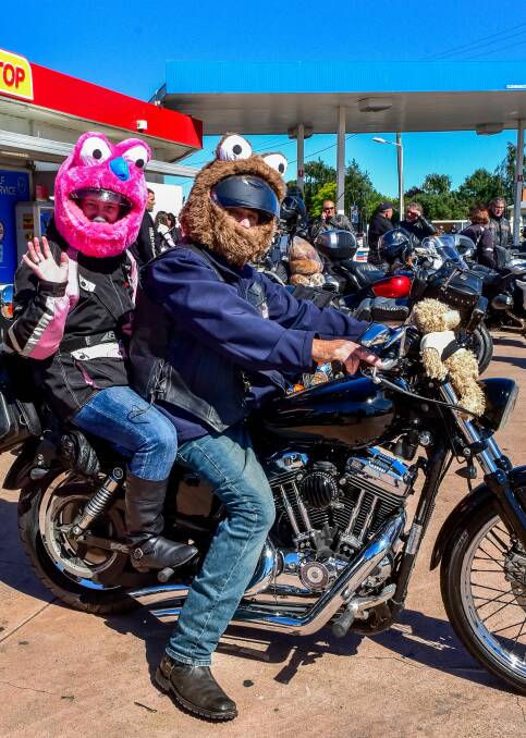 LET HER RIP: Angela Duke and Warren Bakes on the Salvation Army Toy Run on Saturday. Picture: Neil Richardson