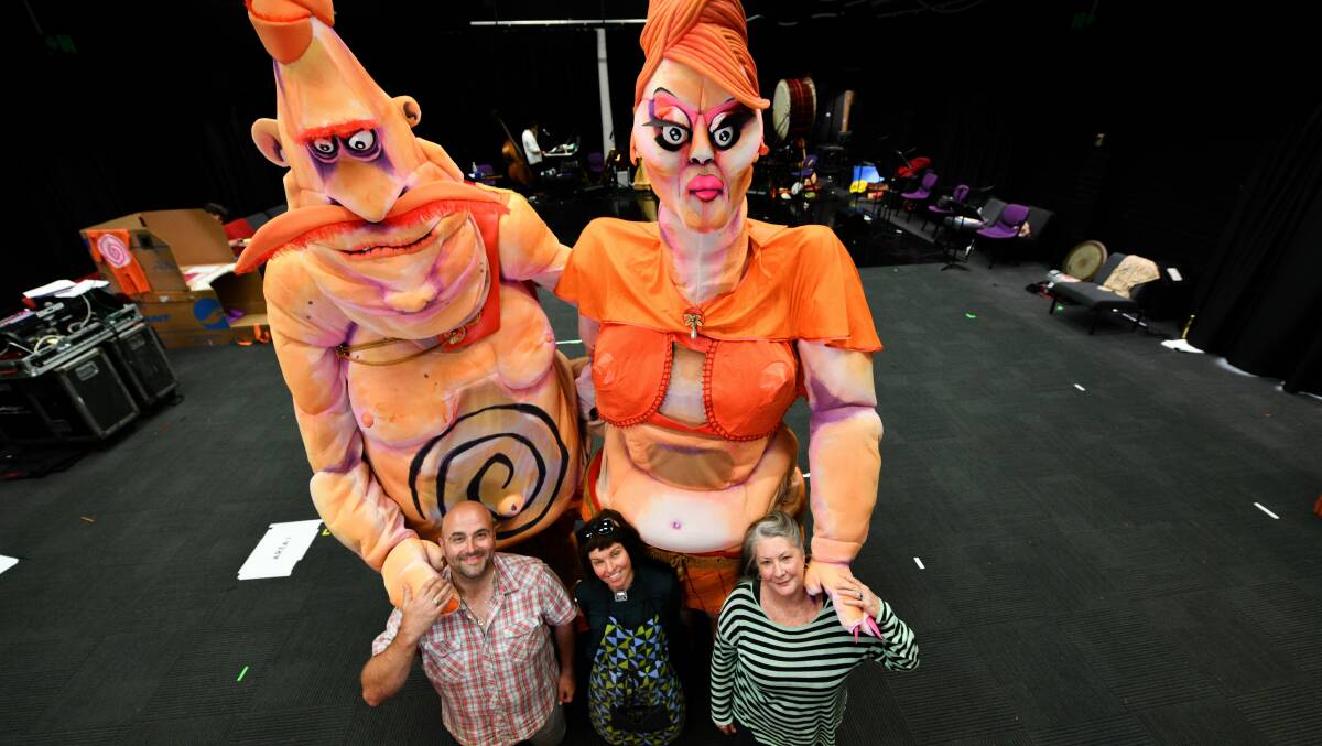 BIG PERSONALITIES: Voice artists John Xintavelonis and Kris McQuade flank puppet maker Bryony Anderson in the shadow of Ma and Pa Ubu as rehearsals for the Mona Foma performance of King Ubu take place in Launceston. Picture: Scott Gelston