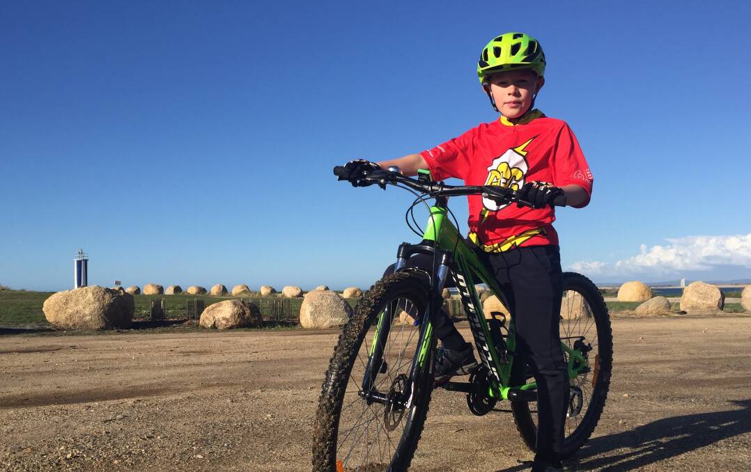 EASY RIDER: Connor Burns, 9, is raising money to find a cure for cancer. Picture: Frances Vinall