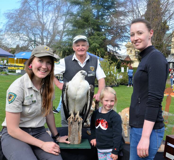 ACTIVITIES: Riss Giddings, John Bowden, and Elise and Michaela Pinner at the Parks and Wildlife stall at Blooming Tasmania on Sunday. Picture: Frances Vinall