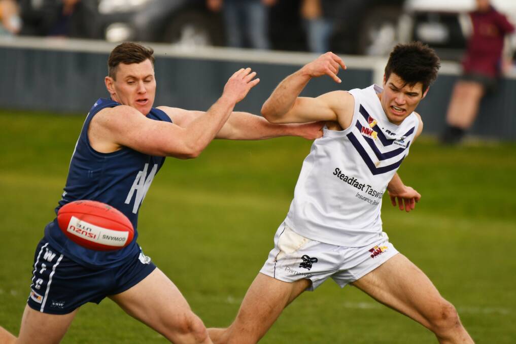 See ball, get ball: Wynyard's Josh Whitehouse and Burnie's Blair Challis battle to claim possession during Saturday's NWFL clash at Wynyard. Picture: Brodie Weeding.