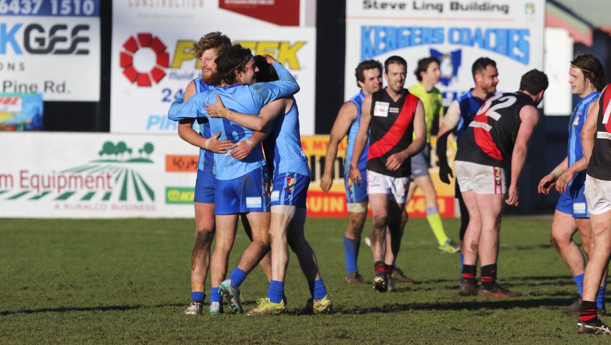 Fine farewell: Penguin players celebrate their 14-point win over Ulverstone, which was also the final roster game at their 112-year-old home ground. Picture: Cordell Richardson.