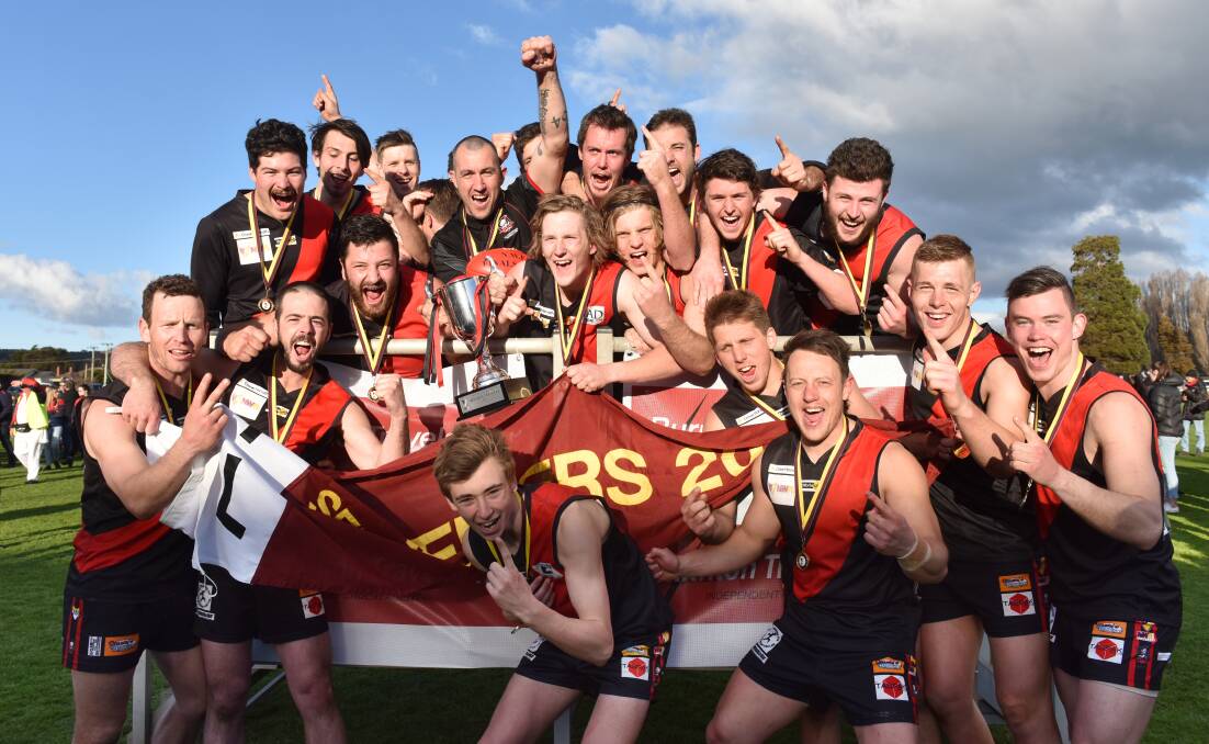 Flying high: Ulverstone celebrate winning the 2017 NWFL senior premiership after a 24-point win over Latrobe on Saturday. Picture: Brodie Weeding.