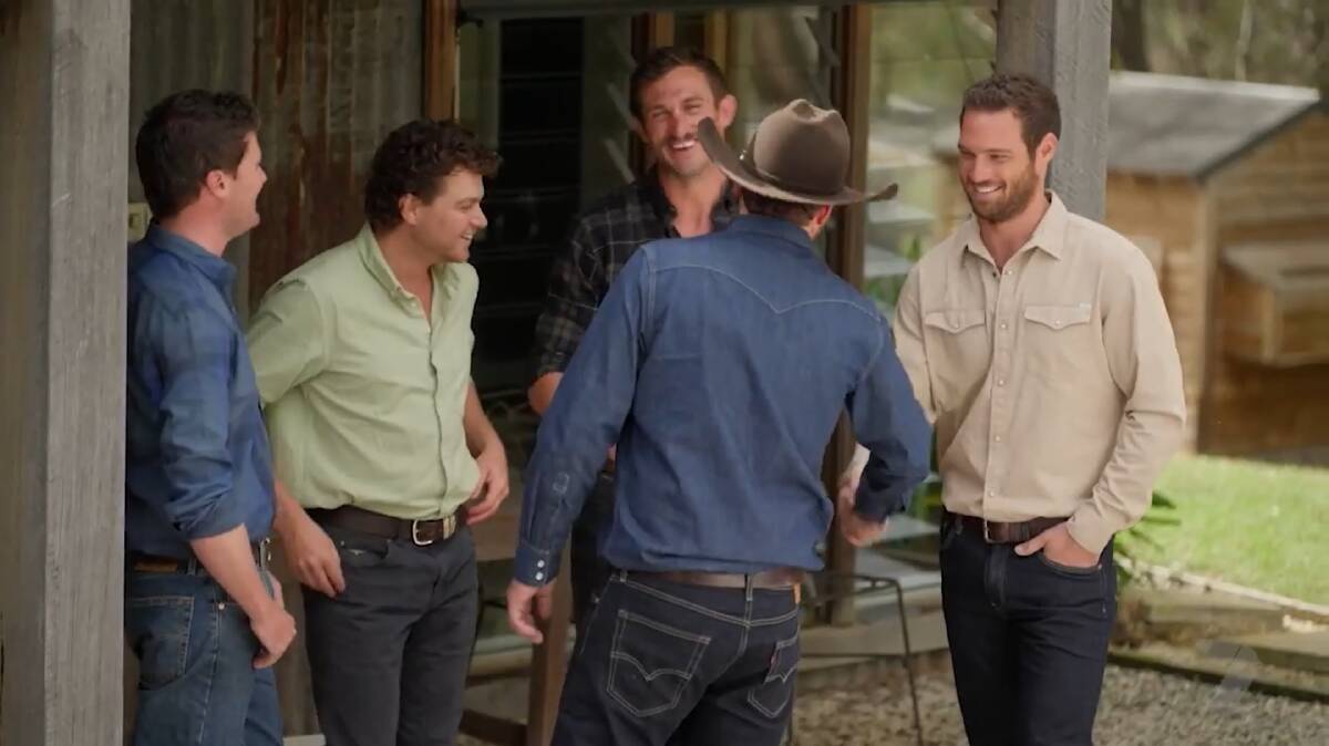 Farmer Todd goes in for an unprecedented second handshake, making some of the blokes shift uneasily. Picture supplied 