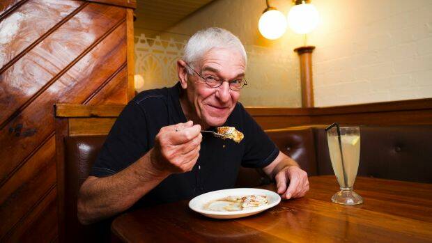 "The Original Pancake Man" Philip Barton eating pancakes that he made, topped with whipped butter and maple syrup. Photo: Dion Georgopoulos
