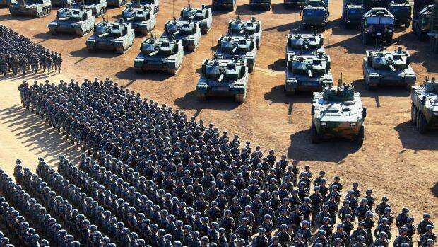 People's Liberation Army troops march past a range of military vehicles at the parade, the first of its kind to mark Army Day. Photo: Xinhua via AP