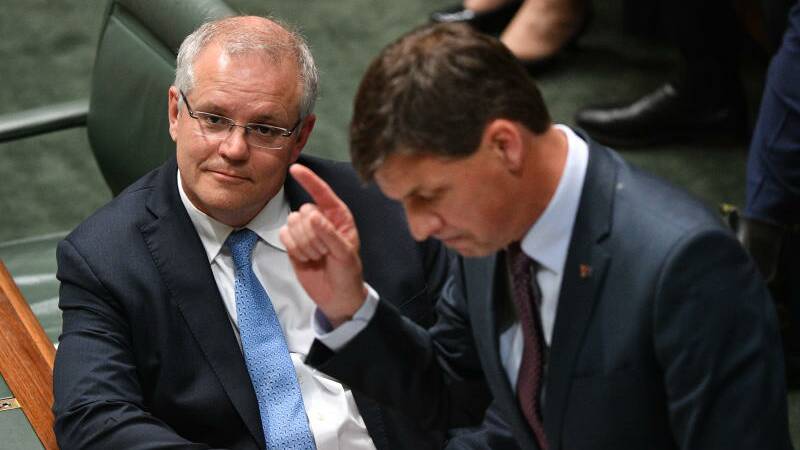 Prime Minister Scott Morrison (left) looks on as Minister for Energy Angus Taylor during Question Time on Monday. Photo: AAP Image/Mick Tsikas