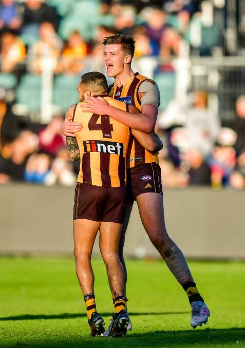 PUMPED UP: Young Hawks forward Mitchell Lewis celebrates with Jarman Impey after slotting one of a career-high three goals.