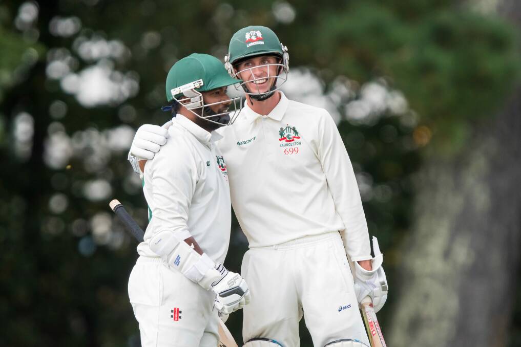 PARTY TIME: Launceston openers Dilan Sandagirigoda and Cameron Lynch share a laugh between overs. Picture: Phillip Biggs