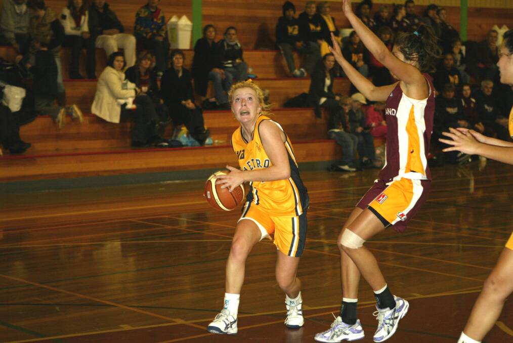 Teyla Evans (right) in action for Queensland North at Elphin Sports Centre in 2009. 