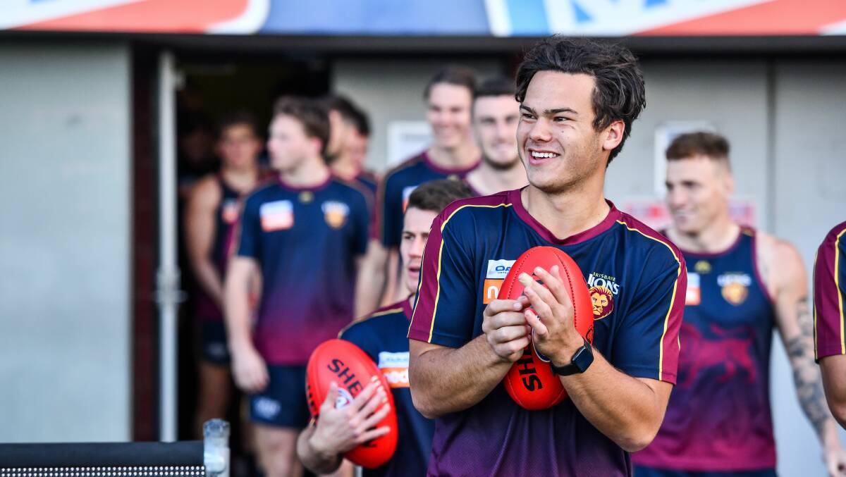 RARING TO GO: Brisbane Lions young gun Cam Rayner leads the squad out onto UTAS Stadium. Picture: Scott Gelston