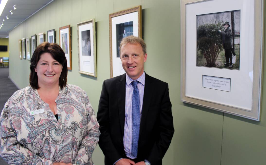 OPENING: Deloraine House coordinator Narelle Whatley and Meander Valley mayor Craig Perkins inspect a piece at the ARTrium exhibition. 