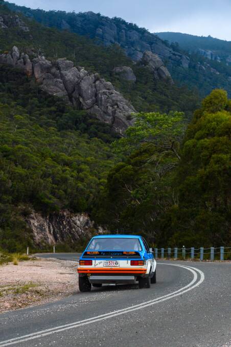 HUGGING THE CORNER: Shannons Classic GT duo Michael and Daniel Bray pick the lines in their 1975 Holden Torana. Picture: Angryman Photography