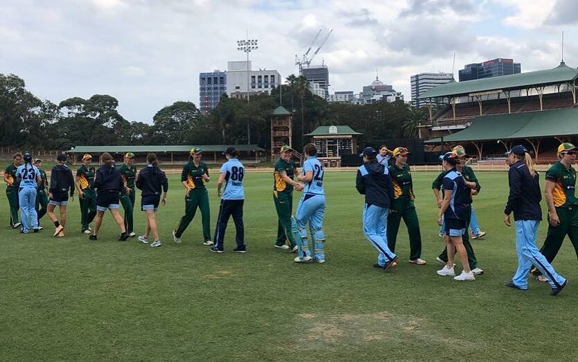 SO CLOSE: Tigers players shake hands with their NSW counterparts. Picture: Facebook