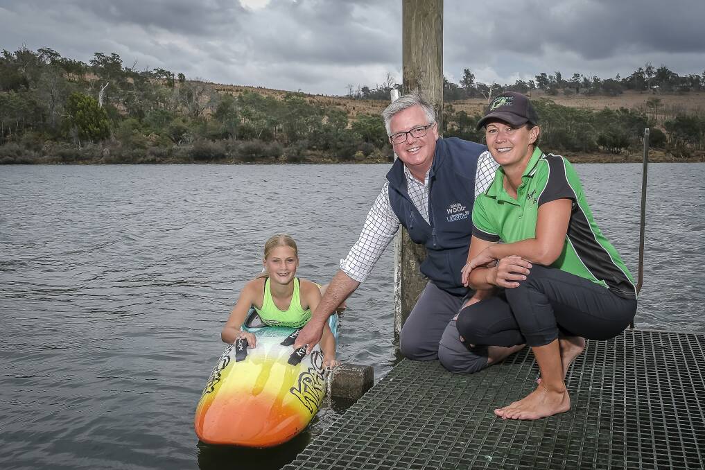 Bridport Surf Life Saving Club's Bonnie Dennis and Bec Dennis with Bass Liberal MP Simon Wood. Picture by Craig George