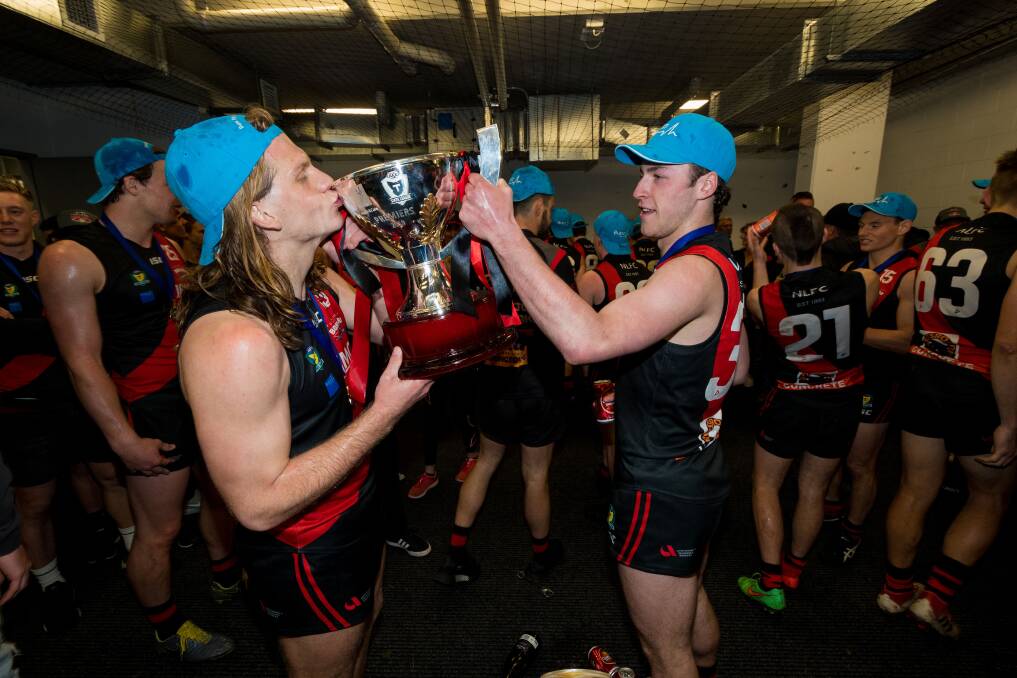 CUP IT UP: Liam Davies and Fletcher Bennett celebrate in the rooms. Pictures: Phillip Biggs 